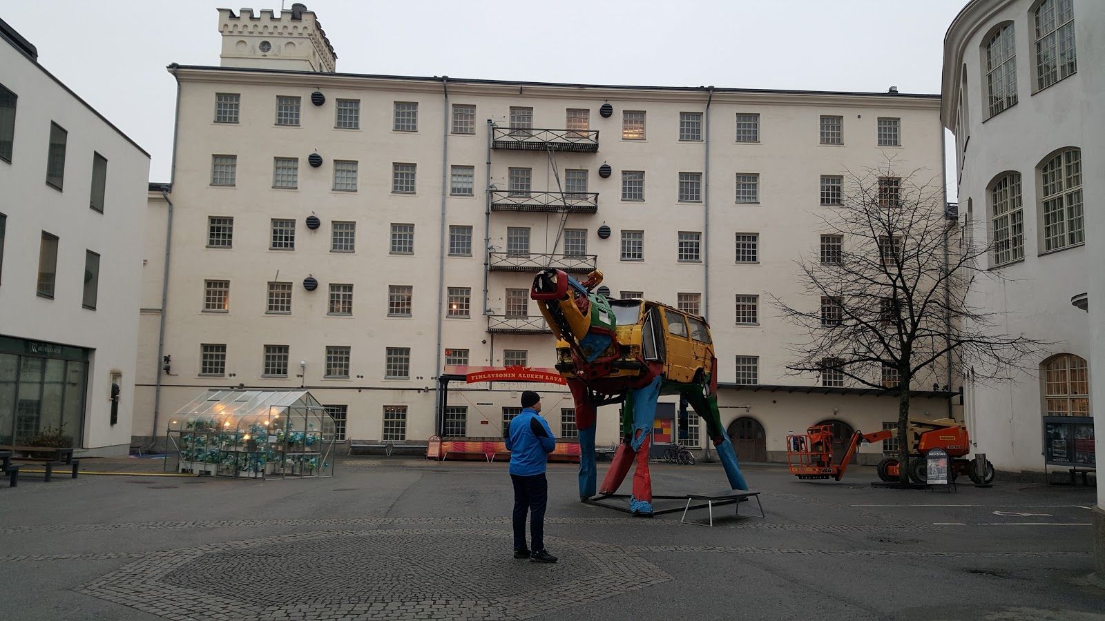 Aerial view of the Tampere city at sunset. Tampella building. View over Tammerkoski river in warm sunlight.