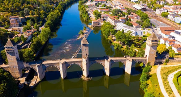 Photo of aerial view of Pont Valentre bridge across the Lot River in Cahors, France.