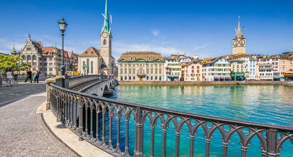 Photo of beautiful view of historic city center of Zurich with famous Fraumunster Church, Switzerland.