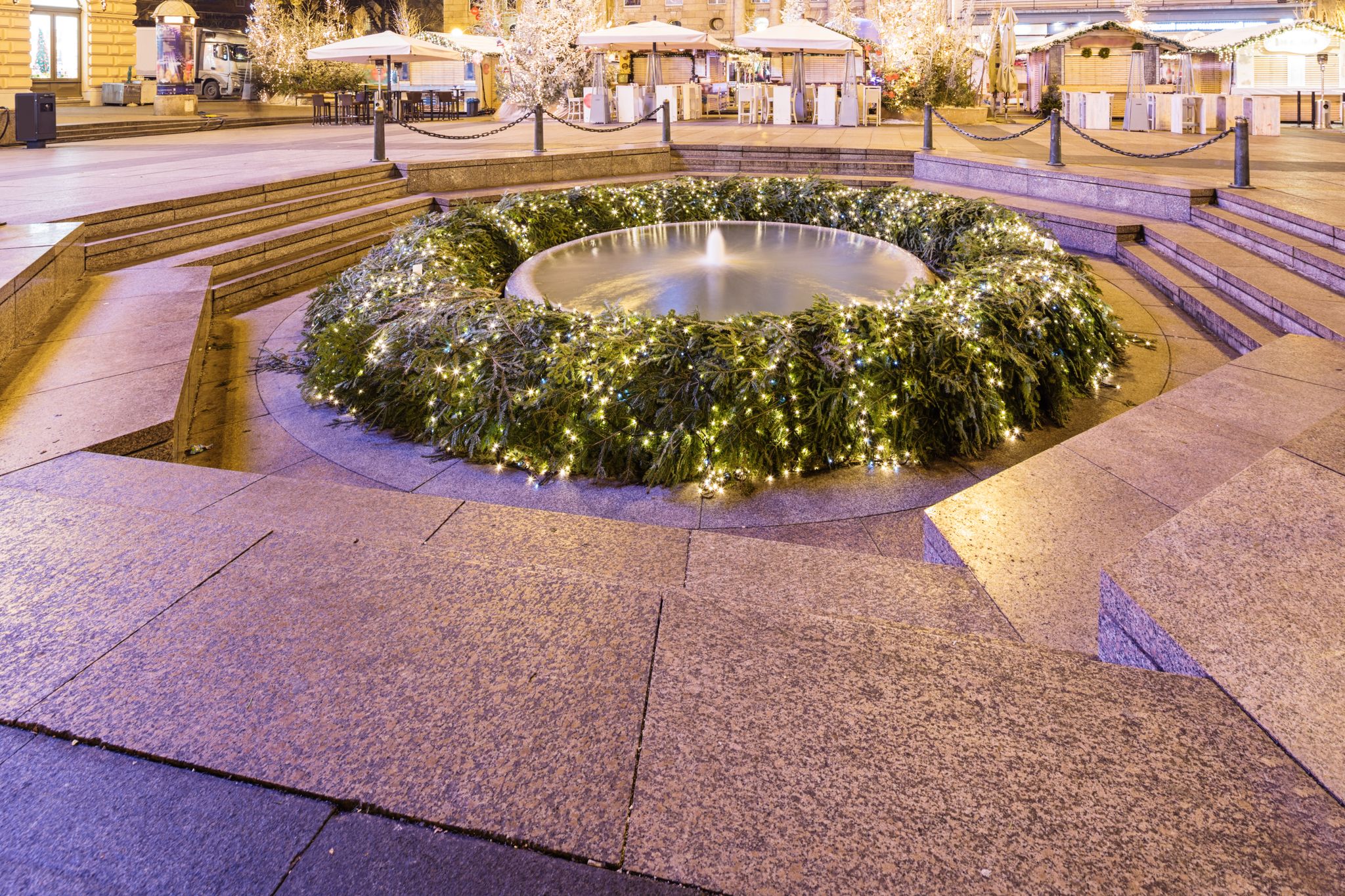 Photo of Mandusevac fountain at night, decorated with advent wreath. Zagreb Central Square of Ban Josip Jelacic, Croatia.