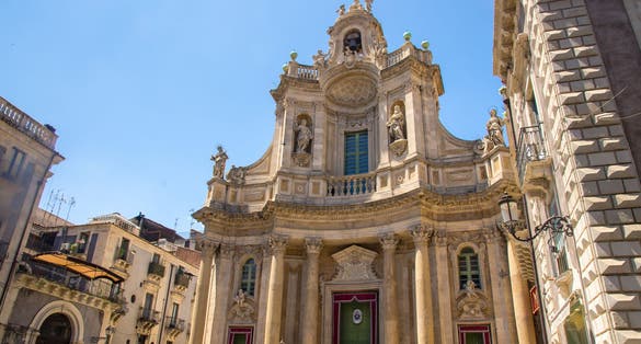 photo of view Basilica della Collegiata Baroque church Santa Maria dell' Elemosina Royal Chapel (Regia Cappella) on Via Etna street in city centre of Catania, Sicily, Italy.