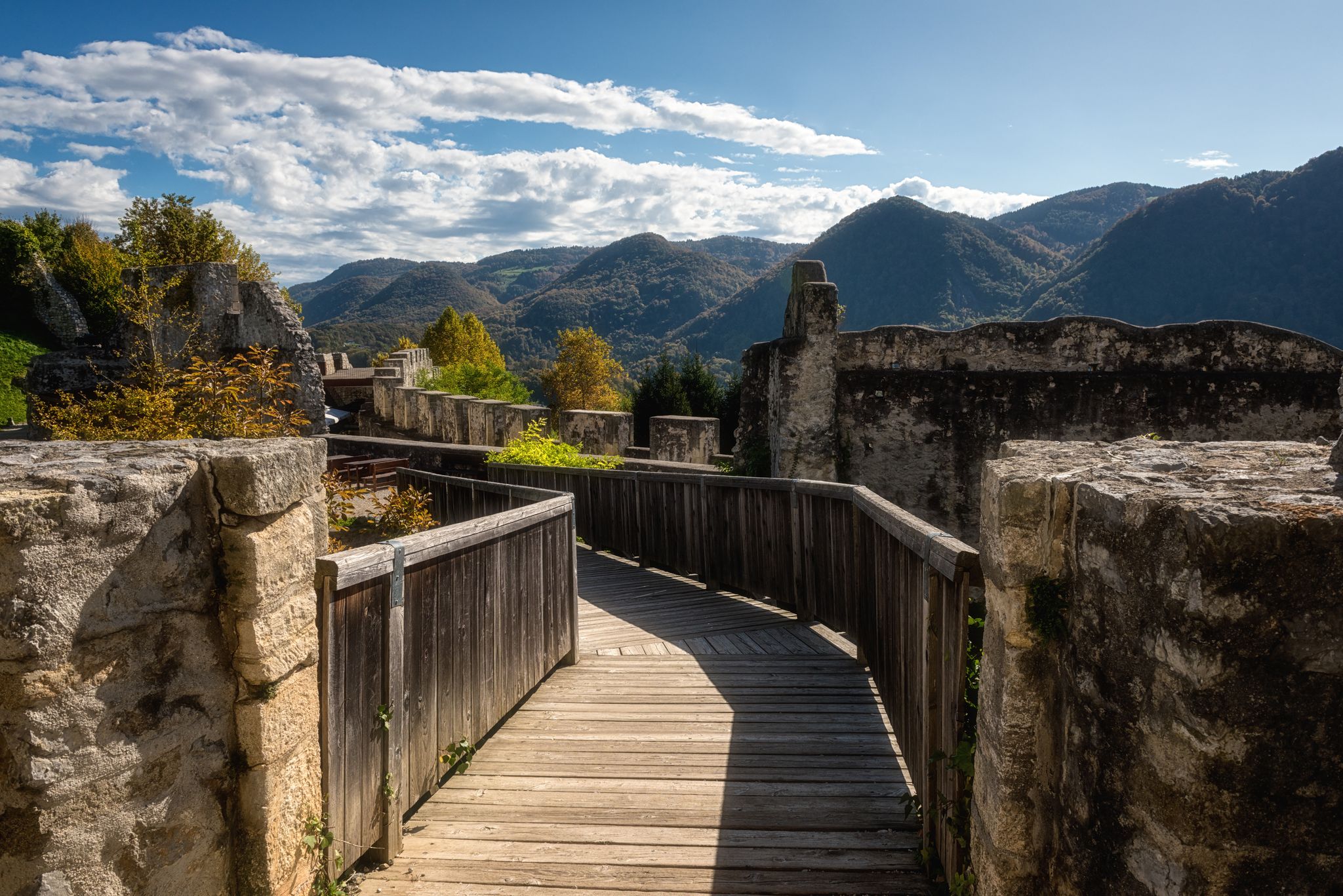 Tourist route on the wooden floor in Celje Old castle (Celjski Stari grad), stunning medieval fortification in Lasko valley in Julian Alps mountains, Celje, Slovenia, Styria. Outdoor travel background