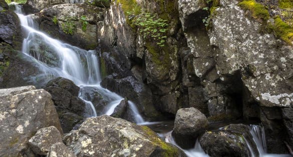 photo of view of A waterfall along the Boyana River in Vitosha Mo,Sofia bulgaria.untain in Bulgaria. Natural scene with water and rocks. Explore Bulgarian waterfalls concept. Beautiful landscape.,
