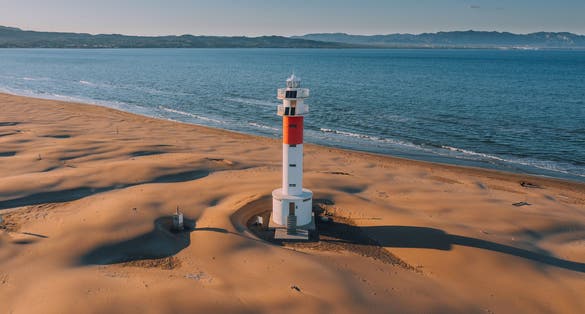 Aerial view of Lighthouse "el Far del Fangar" on Delta de l'ebre natural park, tarragona, Catalonia, Spain.