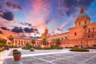 Photo of Palermo Norman cathedral, a UNESCO world heritage site in Italy, colored sunset sky.