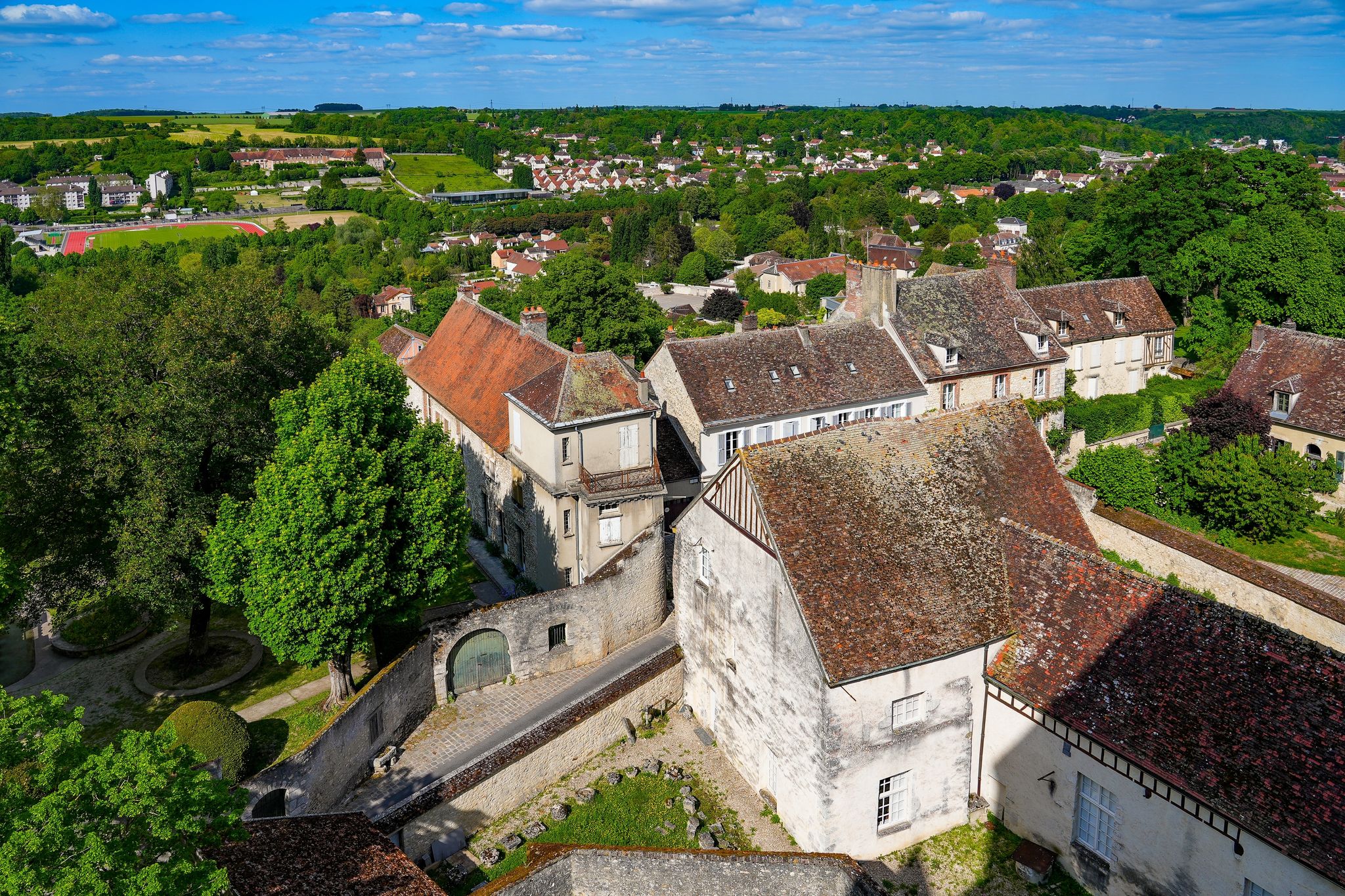 photo of view of Bird's eye view of old stone apartment buildings in Provins, a medieval city in the French department of Seine et Marne in the capital region of Ile de France