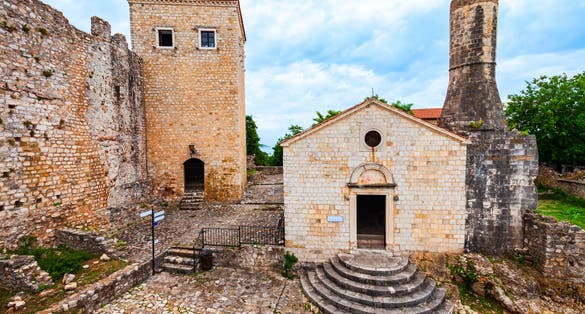 photo of street view of the Archaeological Museum or Local History Museum in Ulcinj Old Town or Stari Grad in Ulcinj, Montenegro. The museum is located in the old church, which was built in 1510.