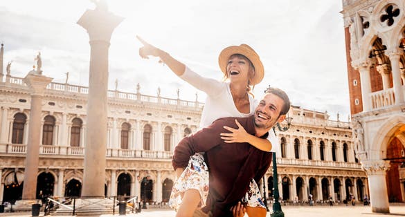 Couple of tourists on vacation in Venice, Italy.