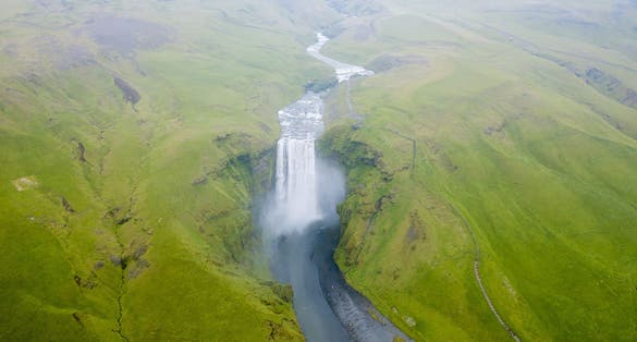 photo of aerial view of the famous skógafoss waterfall in Iceland.