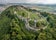 Photo of Aerial panorama of medieval Saris castle with towers, bastions, walls, gates and a donjon in Slovakia.