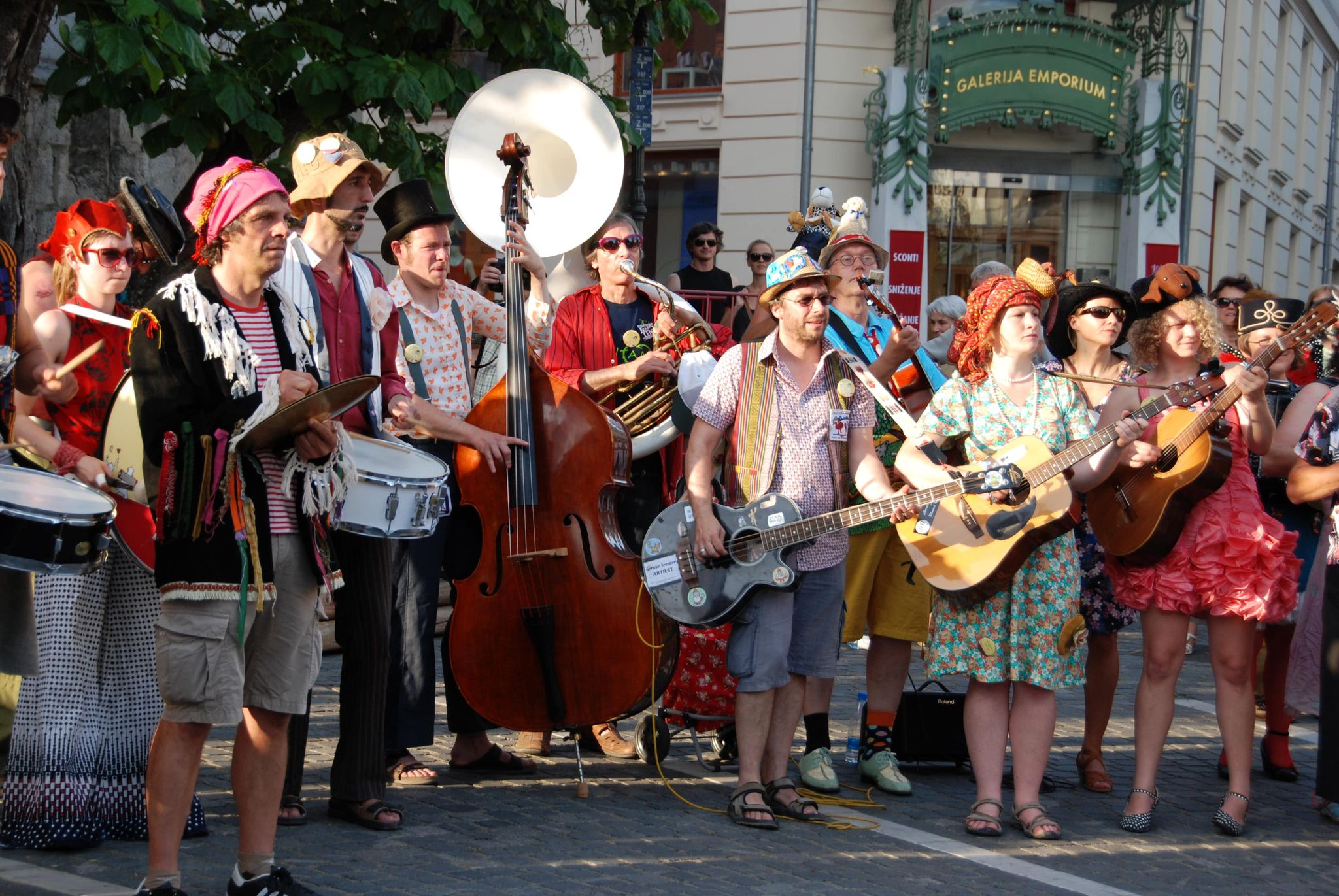 Street band in colorful costumes performing during the Jazz Etno Funky Festival in Koper, Slovenia..jpg