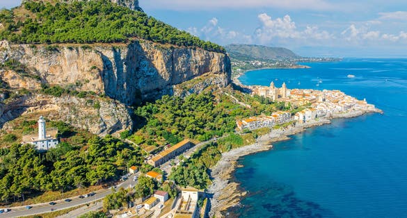 Aerial view showcasing its historic architecture, stunning coastline, and Mediterranean charm of Cefalu, Sicily.