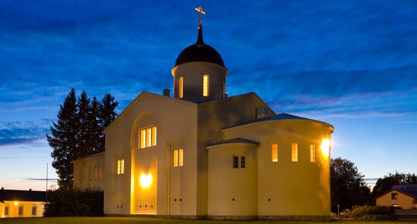 Photo of the main church of the New Valamo Orthodox monastery at night in Heinavesi, Finland.
