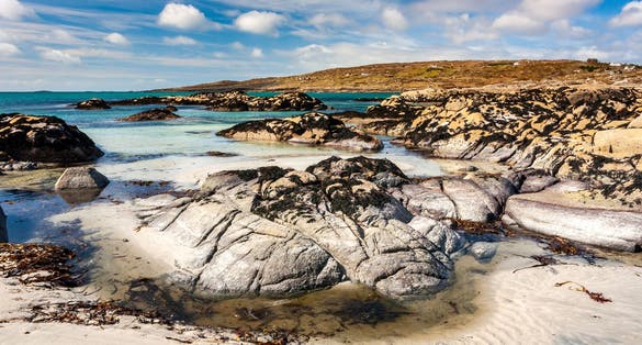 photo of view of Scenic coastline of Dog's Bay in Roundstone, Ireland.
