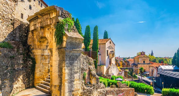Photo of Chiesa dei Santi Siro e Libera catholic church, Roman Theater Archaeological Museum Museo Archeologico with ruins, Piazza del Foro square, Verona city historical centre, blue sky, Veneto Region, Italy