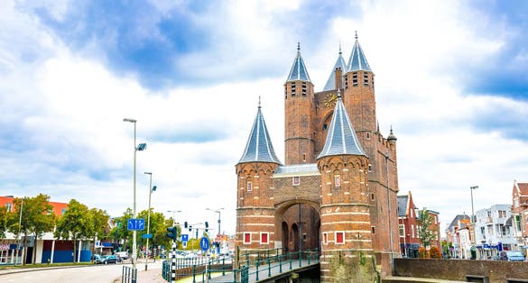 photo of Haarlem attraction, Amsterdamse Poort gateway at morning, Netherlands.