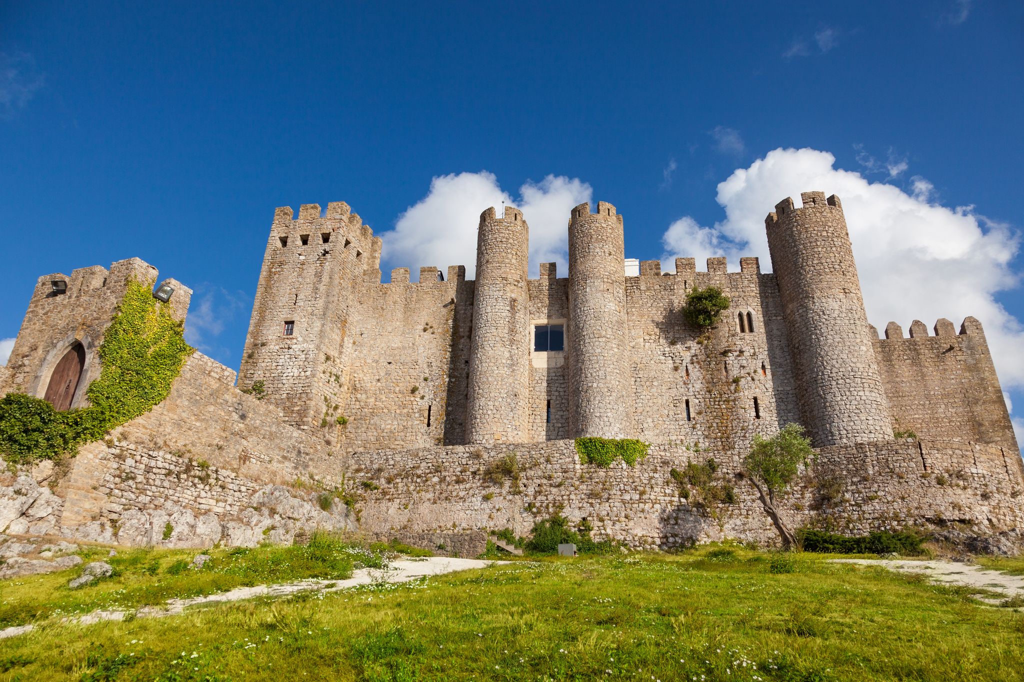 Photo of Stone masonry Castle of Obidos and wall ruins or Castelo de Óbidos is a well-preserved medieval castle located in the civil parish of Santa Maria, Portugal.