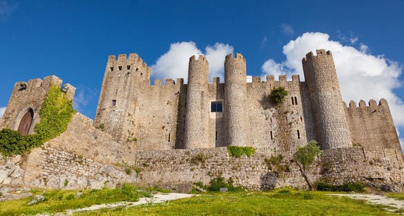 Photo of Stone masonry Castle of Obidos and wall ruins or Castelo de Óbidos is a well-preserved medieval castle located in the civil parish of Santa Maria, Portugal.