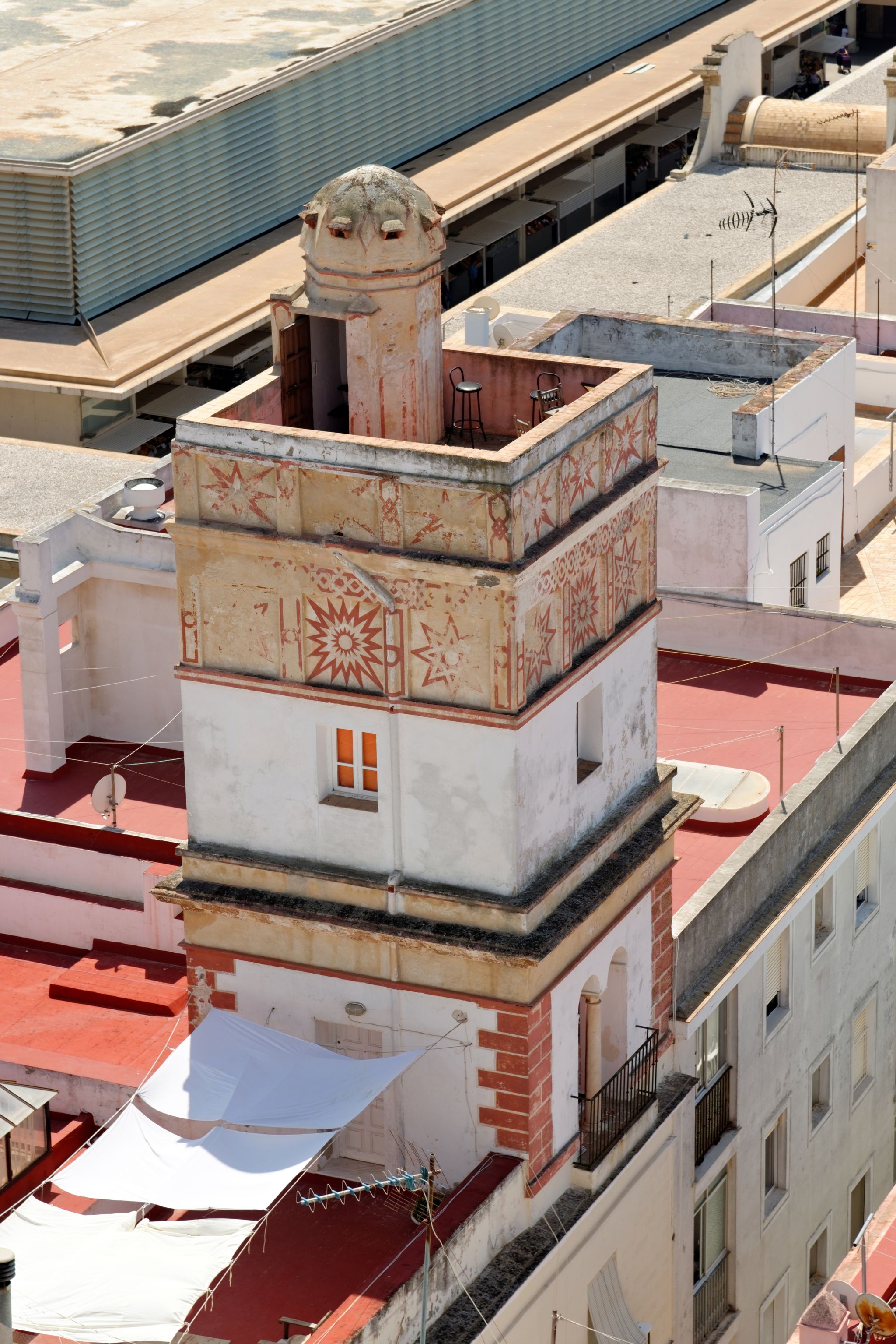 photo of aerial view of Cadiz from Torre Tavira, Andalucia, Spain, an ancient port city, built on a strip of land surrounded by the sea with more than 100 watchtowers, used for spotting ships.