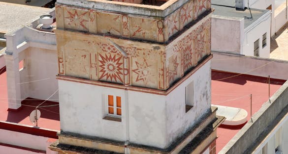 photo of aerial view of Cadiz from Torre Tavira, Andalucia, Spain, an ancient port city, built on a strip of land surrounded by the sea with more than 100 watchtowers, used for spotting ships.