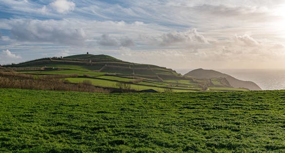 Photo of Panoramic view from the Miradouro da Ponta do Escalvado at the sunset, in the Sao Miguel island. Azores, Portugal.