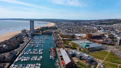 Photo of aerial view of Swansea City Centre, Swansea Bay, The Tower, Swansea Arena, Wales.