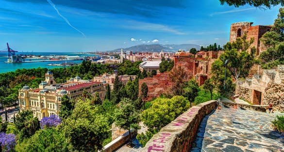Photo of aerial view of Malaga taken from Gibralfaro castle including port of Malaga, Alcazaba castle and the Cathedral, Andalucia, Spain.