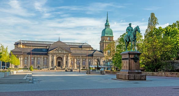 Photo of Panoramic view over Friedensplatz square to Hessian State Museum in German university city Darmstadt during daytime .