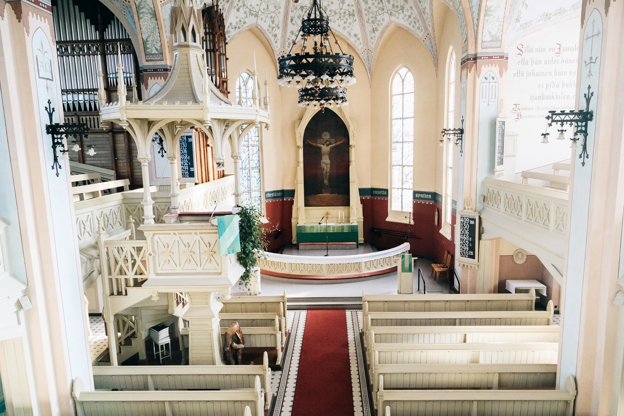 The interior of the Evangelical Lutheran Church of Joensuu. Neo-gothic style. Sunlit interior with empty benches