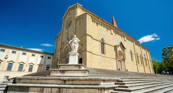 photo of view of Arezzo cathedral and Medici monument, Italy.
