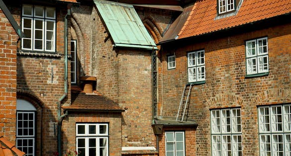 photo of view of streets with old houses in Lübeck, Germany.
