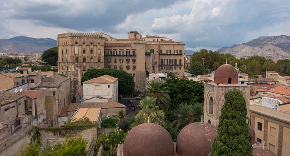 photo of view the famous red domes of the Church of St. John of the Hermits (San Giovanni degli Eremiti) and the Norman Palace (Palazzo dei Normanni) - Palermo, Italy