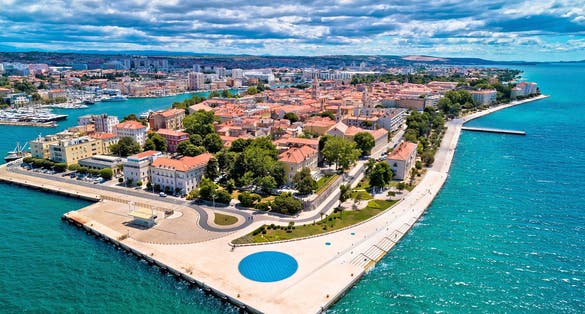 Photo of aerial view of Sea organ (morske orgulje) in Zadar at sunrise, architectural landmark, Croatia.