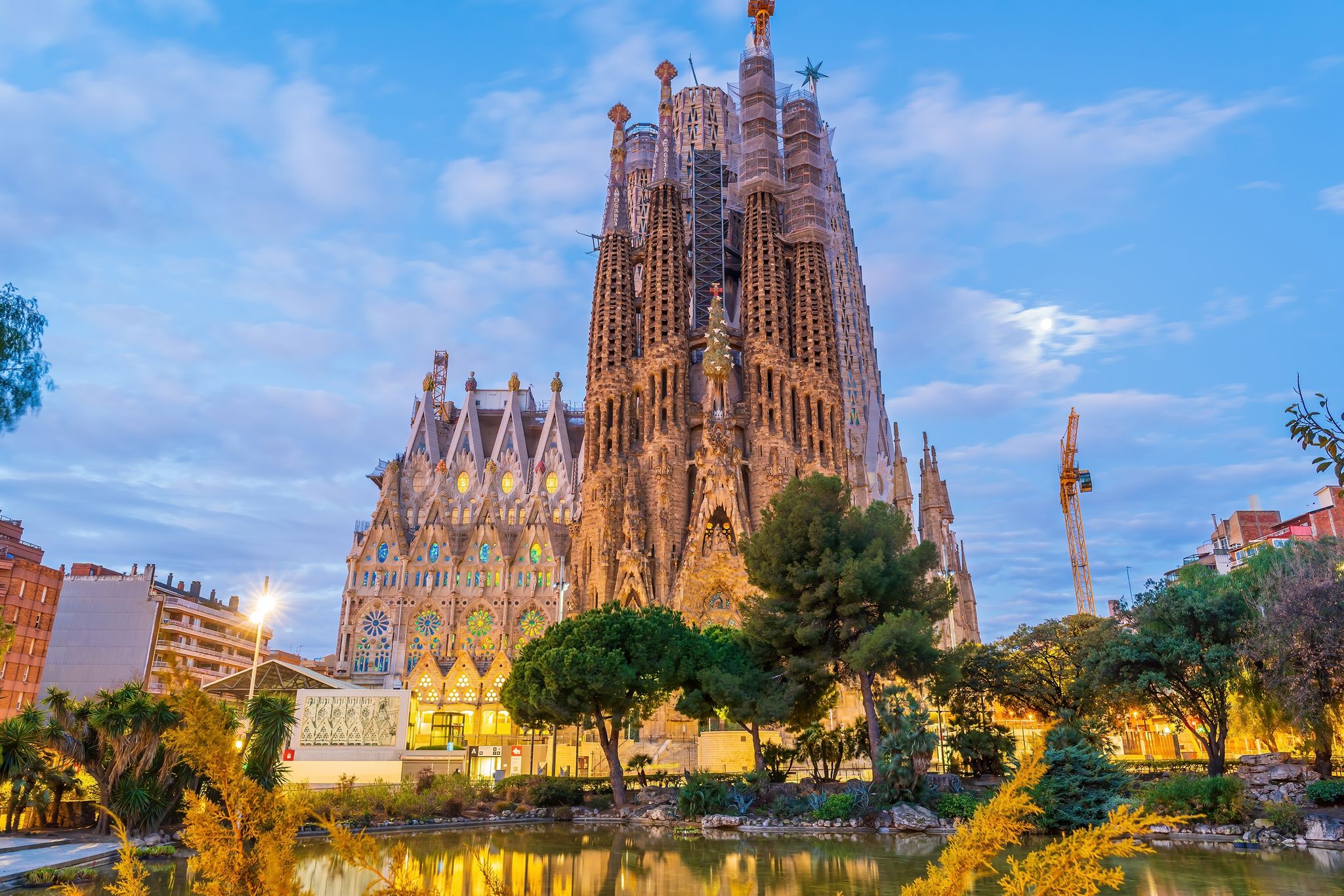 Photo of Sagrada Familia by Antonio Gaudi in downtown Barcelona Spain at the evening.