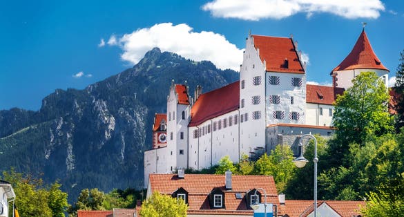 photo of view of Swabian town Füssen with Palace and alps, Bavaria, Germany.