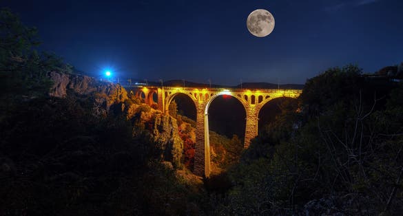 photo of Varda bridge on full moon night in Adana, Turkey.