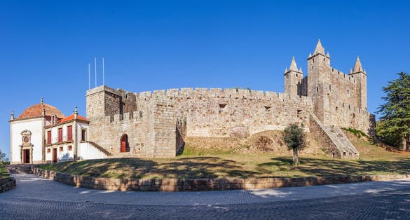 Photo of Castelo da Feira Castle with Nossa Senhora da Esperanca Chapel on the left. Santa Maria da Feira, Portugal.