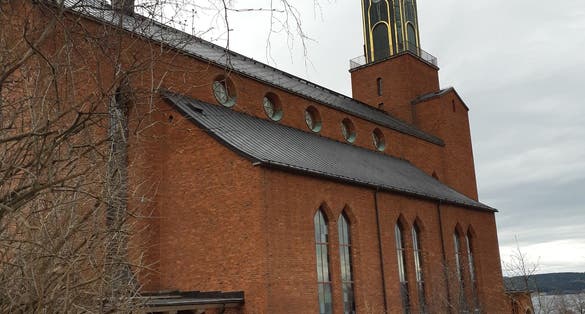 photo of back view of Stora kyrkan church (Great Church) in Ostersund, Sweden.