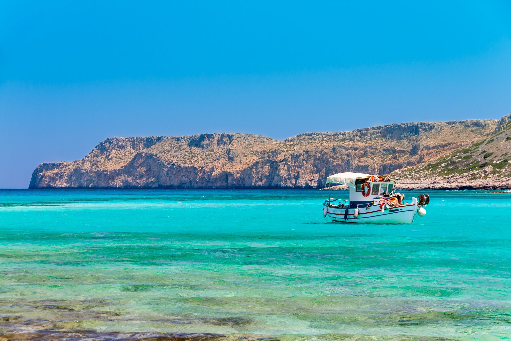 photo of view of Fishing boat near Balos beach. Crete, Greece.