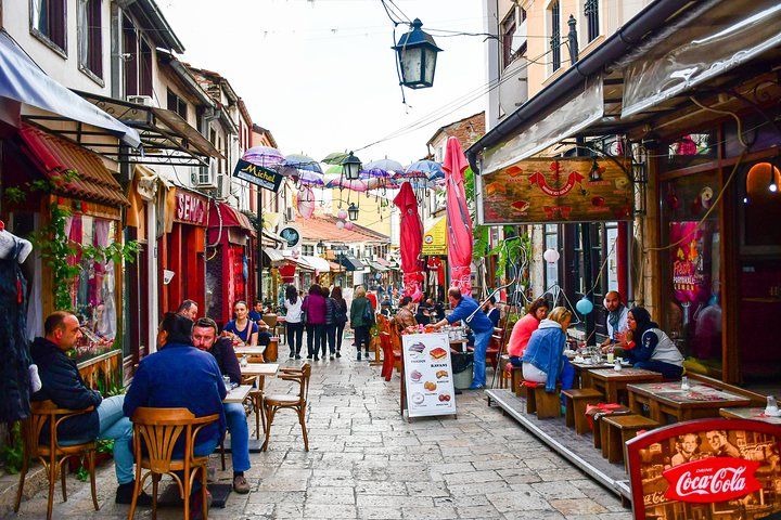 A lively street in the Old Bazaar of Skopje, North Macedonia, with people dining at cafes and walking around..jpg