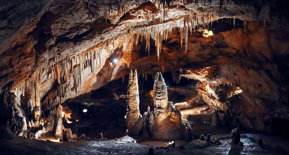 Photo of Stalagmites and stalactites in Lipa Cave, formations Columns and Draperies, Montenegro.
