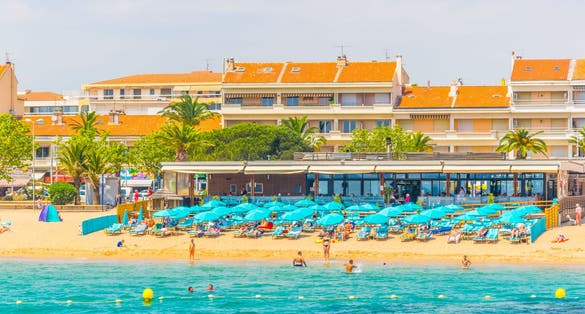People are enjoying summer on a beach in Saint Raphael, France