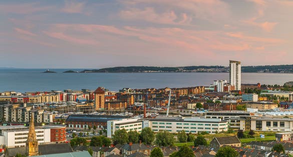 Photo of aerial View of Swansea City at magical sunset ,Wales.