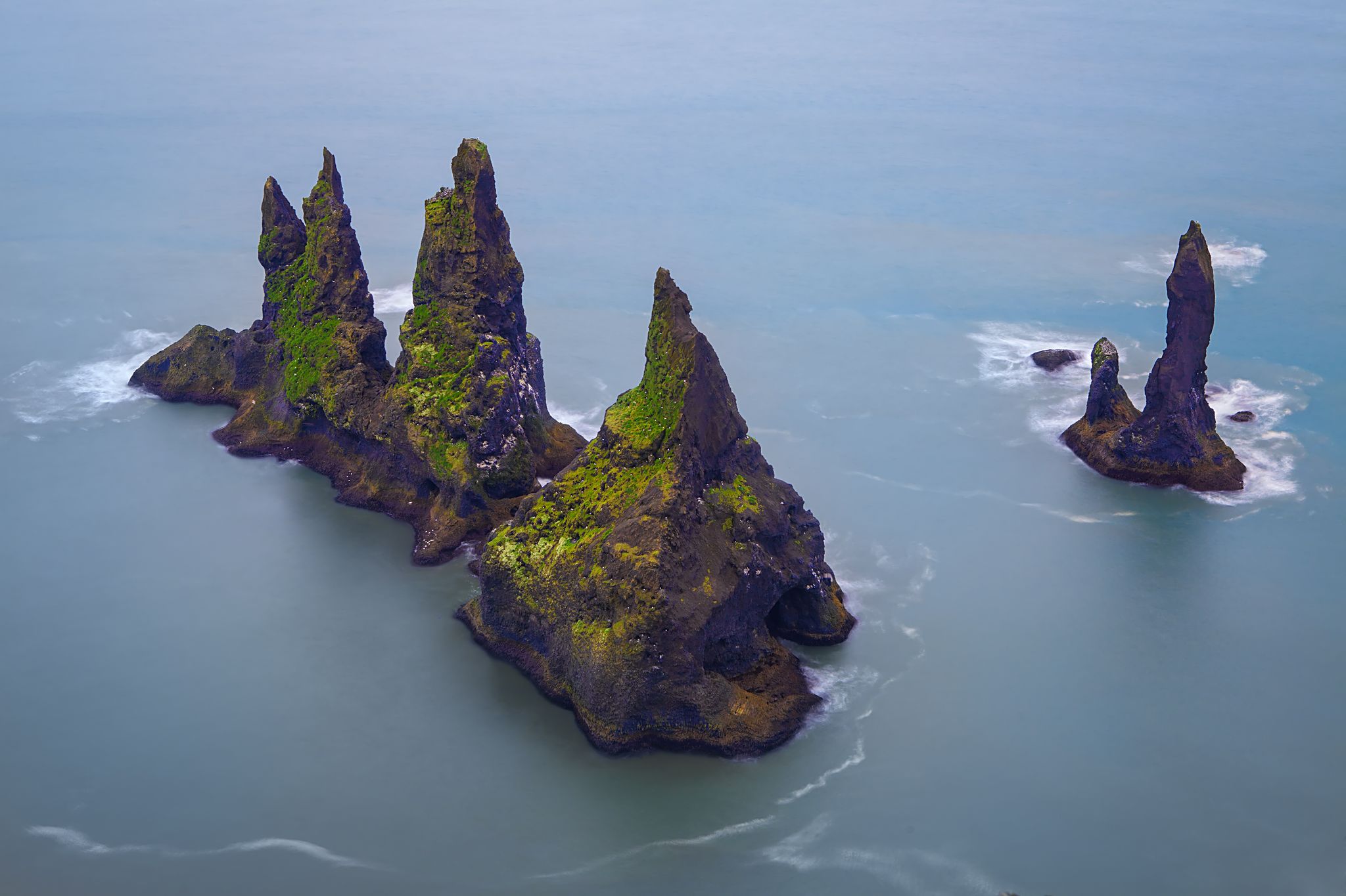 photo of view Famous Reynisdrangar cliffs at south coast of Iceland.