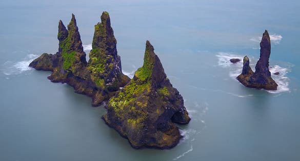 photo of view Famous Reynisdrangar cliffs at south coast of Iceland.