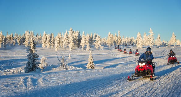 photo of group of snowmobiles in Lapland, near Saariselka, Finland.