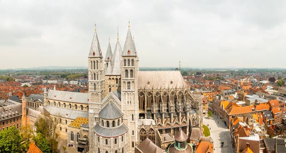 Photo of Notre-Dame de Tournai towers and surrounfing streets with old buildings panorama, Cathedral of Our Lady, Tournai, Walloon municipality, Belgium.