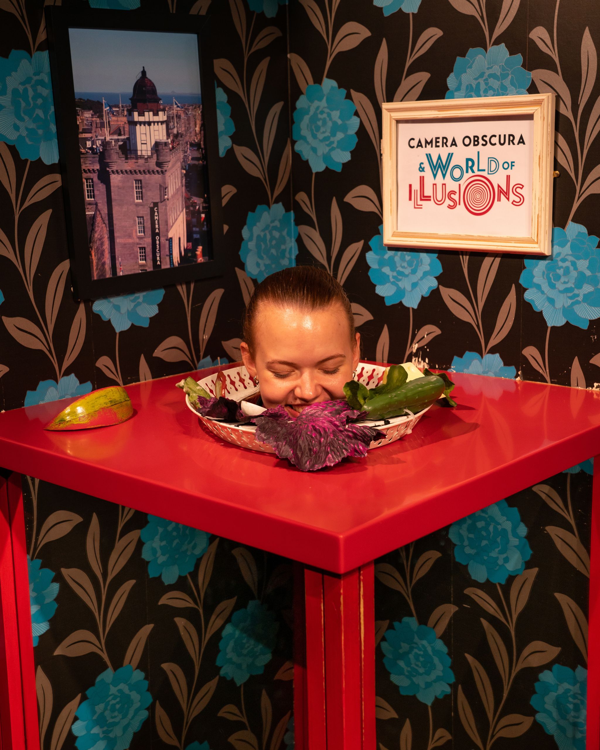Camera Obscura World of Illusions amazing exhibition of cool effects. Womans head on the plate with some vegetables 90% focus.