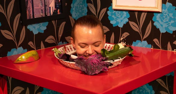 Camera Obscura World of Illusions amazing exhibition of cool effects. Womans head on the plate with some vegetables 90% focus.
