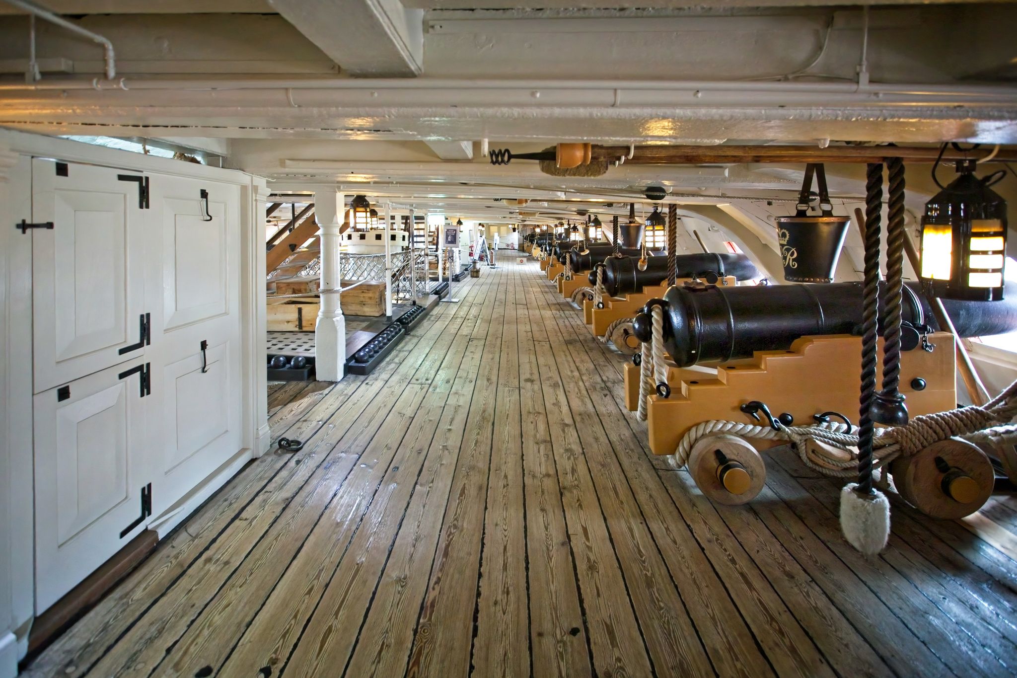 Rows of cannons in the gun deck on board HMS Victory, in Portsmouth Dockyard, Hampshire, UK.
